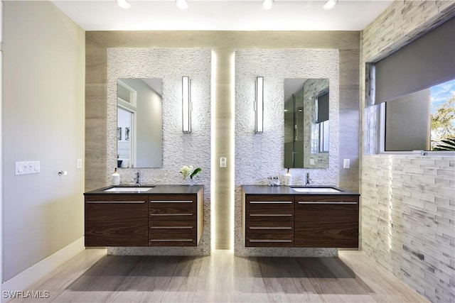 bathroom featuring vanity and tasteful backsplash