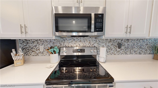 kitchen with white cabinetry and appliances with stainless steel finishes