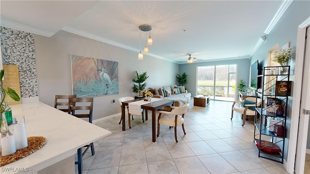 dining room with ceiling fan, light tile patterned floors, and ornamental molding