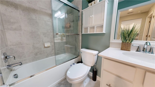 full bathroom with tile patterned floors, toilet, vanity, and combined bath / shower with glass door