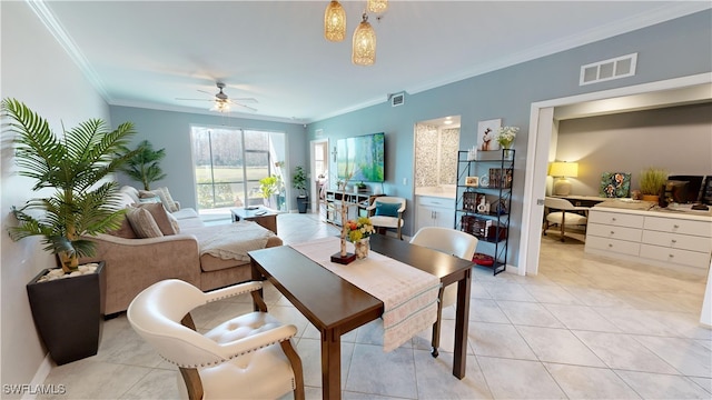 tiled dining room featuring ceiling fan and ornamental molding