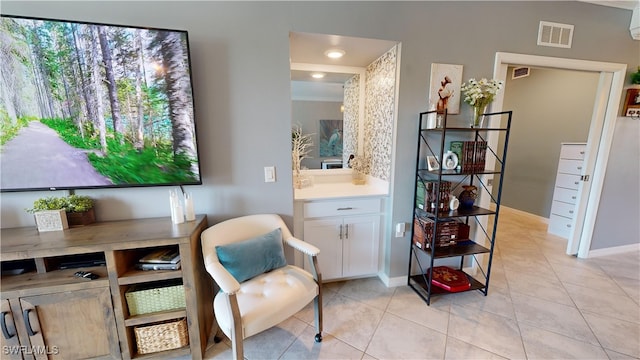 living area featuring light tile patterned flooring