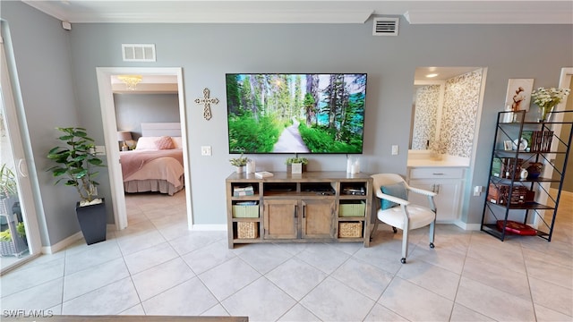 interior space featuring light tile patterned floors and crown molding