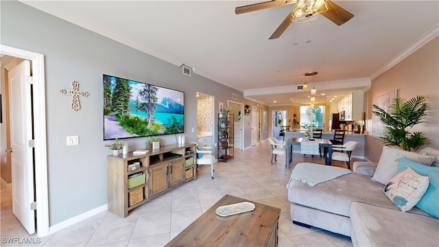 tiled living room featuring ceiling fan and crown molding