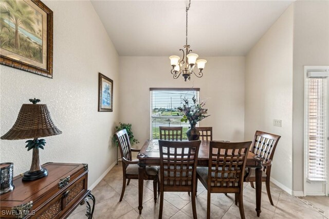 dining room featuring a chandelier and light tile patterned floors