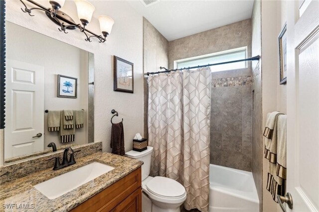 full bathroom featuring vanity, toilet, and shower / tub combo