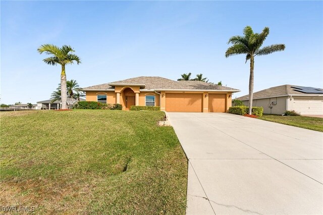 view of front of home featuring a garage and a front lawn