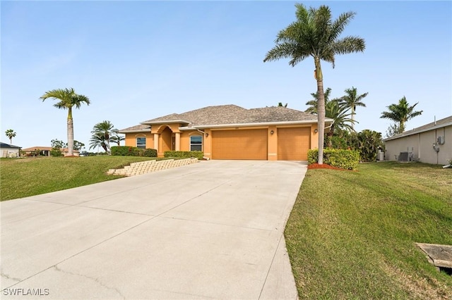 view of front of home featuring a garage, central air condition unit, and a front lawn