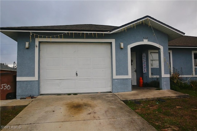 ranch-style home with a garage