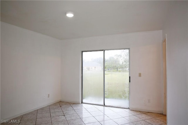 empty room featuring light tile patterned flooring