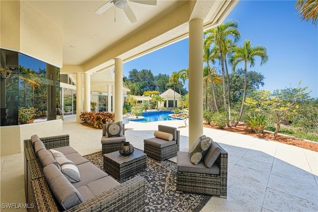 view of patio / terrace featuring ceiling fan and an outdoor living space