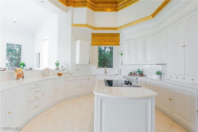 kitchen featuring a high ceiling, a center island, white cabinetry, ornamental molding, and black electric cooktop