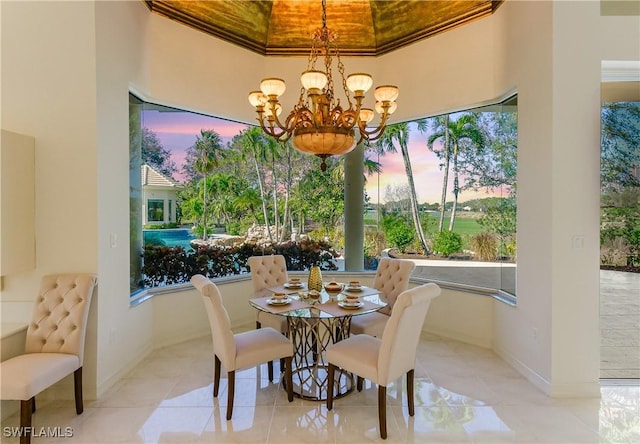 tiled dining area with crown molding and a notable chandelier