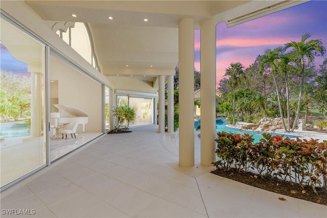 view of patio terrace at dusk