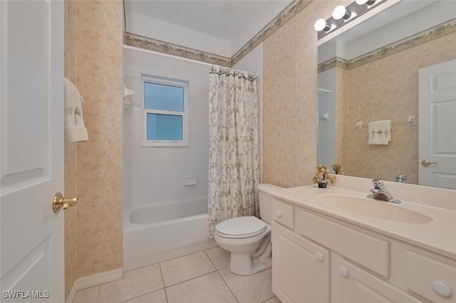 full bathroom featuring toilet, vanity, tile patterned floors, and shower / tub combo with curtain