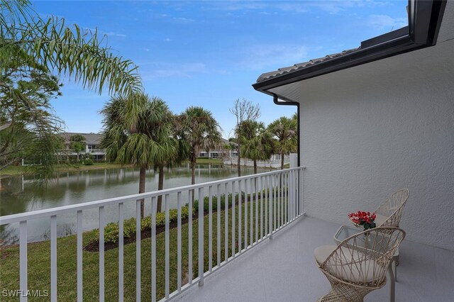 balcony featuring a water view