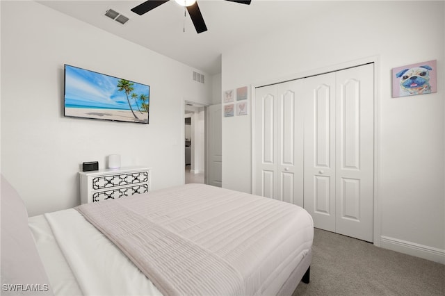 bedroom with ceiling fan, a closet, and carpet floors