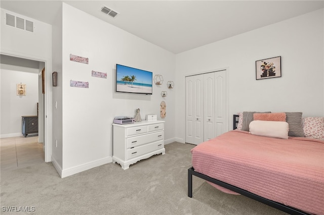 carpeted bedroom with a closet