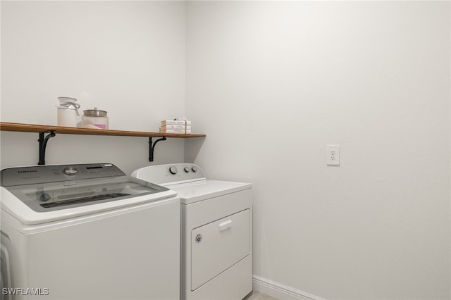 laundry room featuring separate washer and dryer