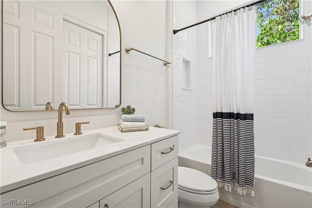 full bathroom with vanity, toilet, and shower / bath combo with shower curtain