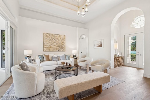 living room featuring light hardwood / wood-style floors and a chandelier