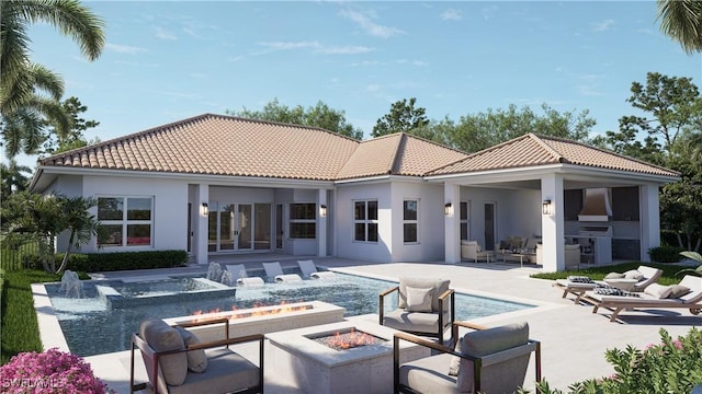 rear view of house featuring a tile roof, stucco siding, an outdoor kitchen, an outdoor fire pit, and an in ground hot tub