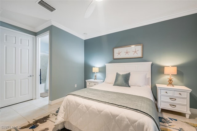 bedroom with crown molding, ensuite bath, light tile patterned floors, and ceiling fan