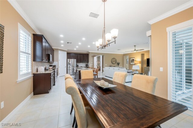 dining area with light tile patterned floors, ornamental molding, visible vents, and recessed lighting