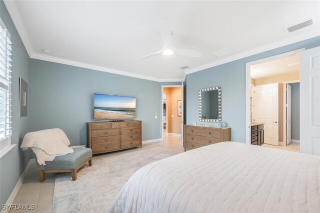 tiled bedroom with crown molding, ensuite bath, and ceiling fan