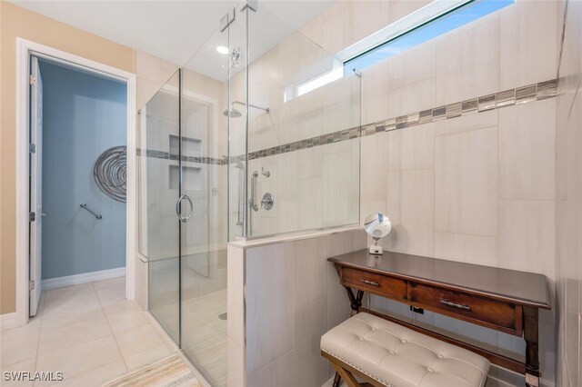 bathroom featuring an enclosed shower and tile patterned flooring