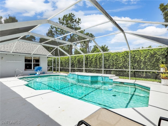 view of pool featuring a lanai and a patio