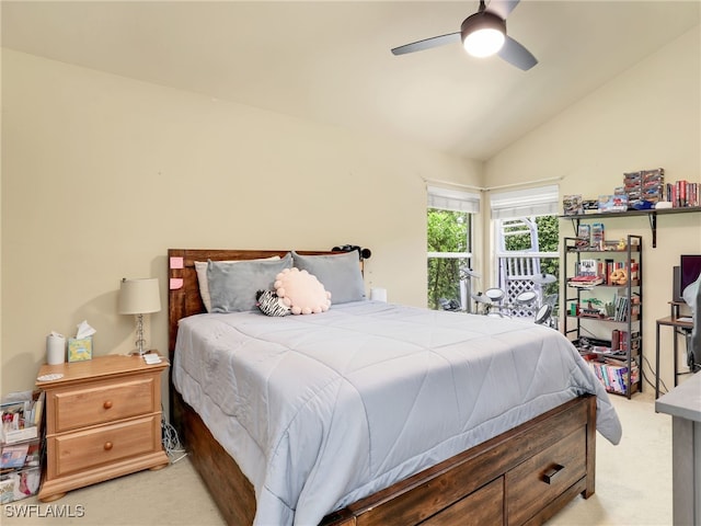 carpeted bedroom featuring ceiling fan and lofted ceiling