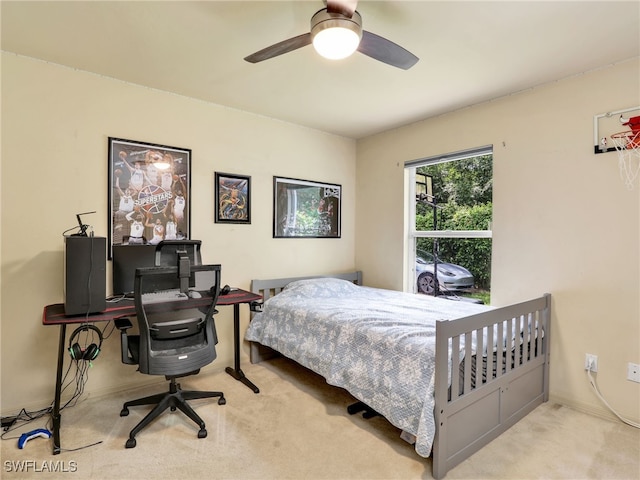 bedroom featuring ceiling fan and light carpet