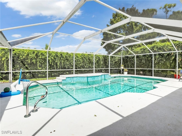 view of pool featuring a lanai and a patio