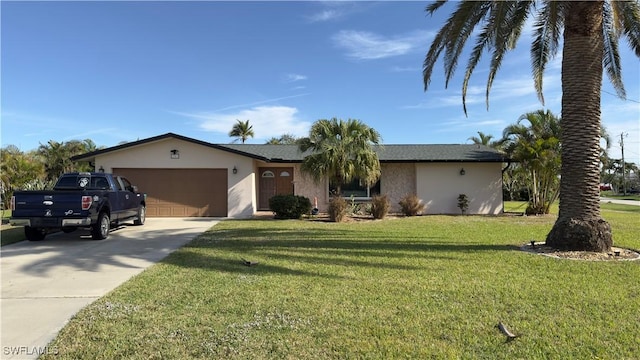 ranch-style home with a front yard and a garage