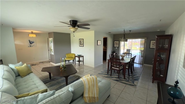 living room featuring ceiling fan and light tile patterned flooring