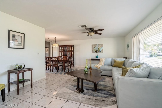 living room with ceiling fan and light tile patterned floors