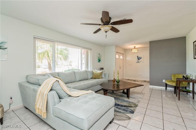 living room featuring ceiling fan and light tile patterned floors