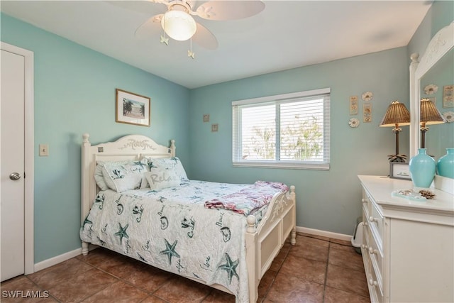 tiled bedroom with ceiling fan