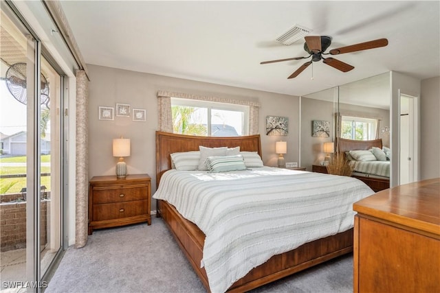 carpeted bedroom featuring access to exterior and ceiling fan