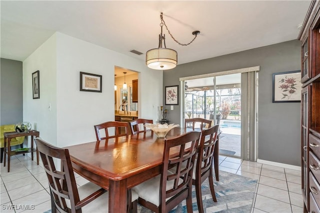 tiled dining area featuring sink