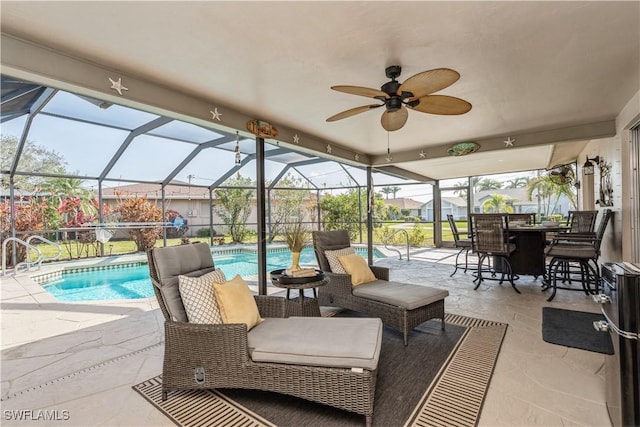 view of patio / terrace with ceiling fan and glass enclosure