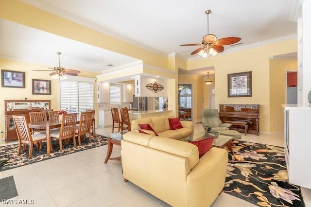 tiled living room featuring ceiling fan and crown molding