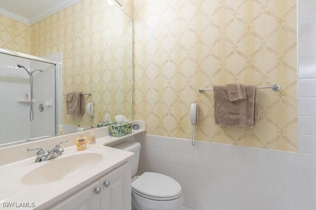 bathroom with toilet, tile walls, walk in shower, crown molding, and vanity