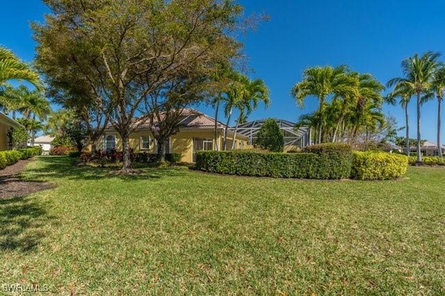 view of yard featuring a lanai