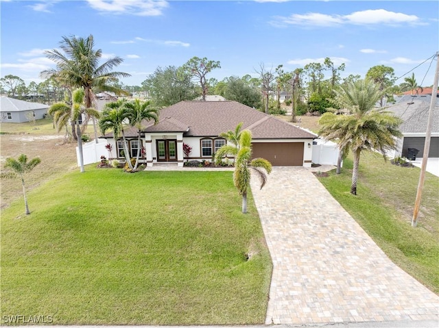 ranch-style house with a front lawn and a garage