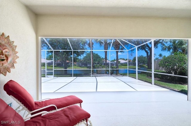 sunroom featuring a pool