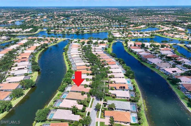 birds eye view of property featuring a water view