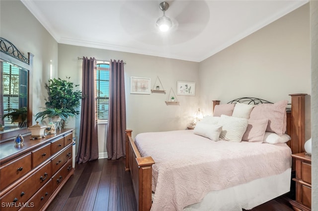 bedroom with ceiling fan, baseboards, dark wood finished floors, and crown molding