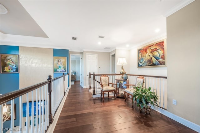 hall with dark hardwood / wood-style floors and ornamental molding